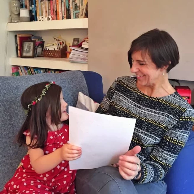 mum and daughter reading an Elf Letter from the international Elf Service. Elfie's Christmas Letters and the North Pole Christmas letters are new each year!