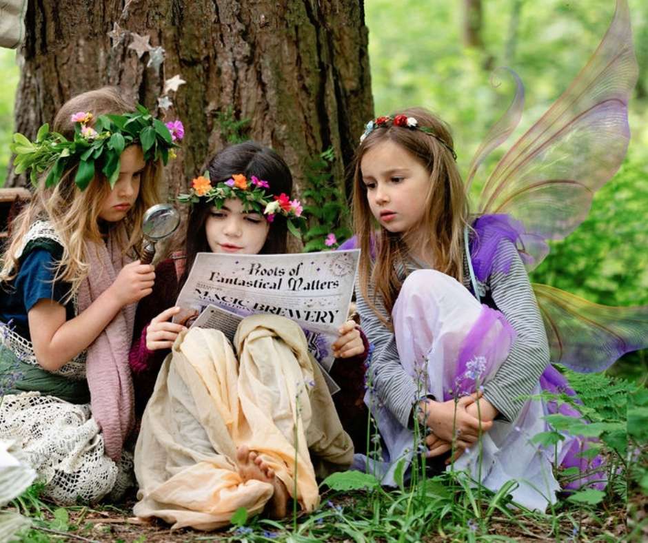 Nymphs and Fairies reading pages from Roots of Fantastical Matters