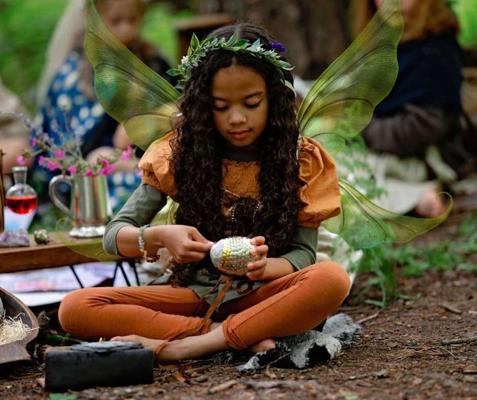 A fairy following the instructions of Roots of Fantastical matters to make Dragon’s Eggs 