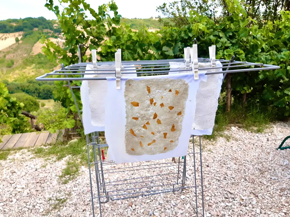 Drying homemade paper for your Book of Magic - a wonderful family activity by International Elf Service