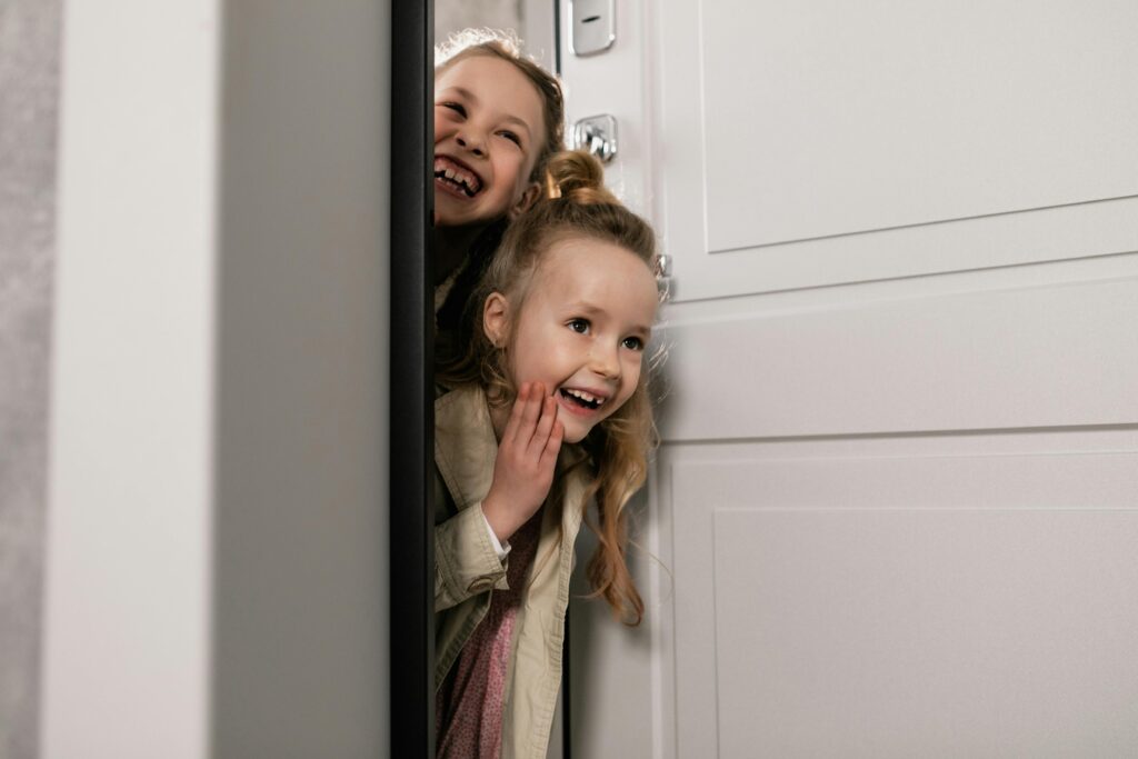 Two excited children looking to see if the Elves have delivered a letter from the North Pole with news from the Elves’ Workshop
