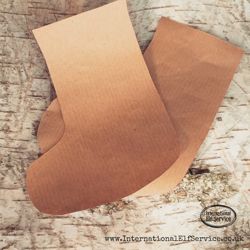 How to make the cutest brown paper Christmas stockings to stuff with treats and pop into their Christmas stockings!