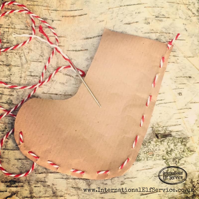 How to make the cutest brown paper Christmas stockings to stuff with treats and pop into their Christmas stockings!