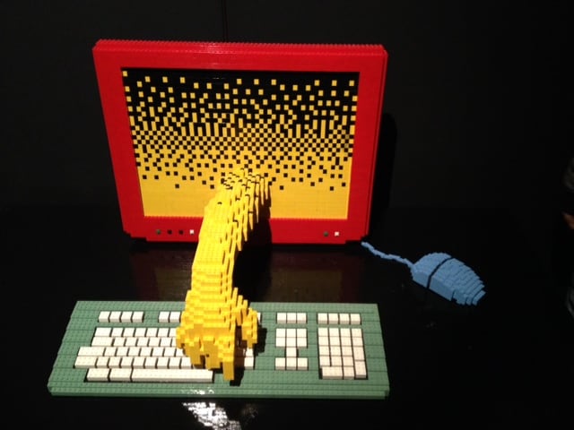 A lego computer operating itself at the 'Art of The Brick' exhibition in London